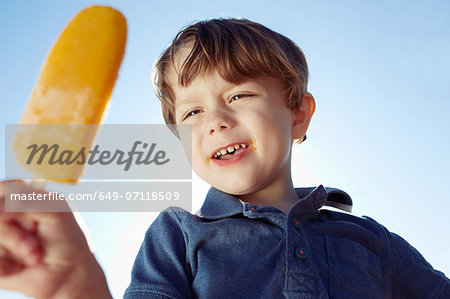Boy eyeing his ice lolly