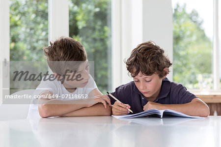Brothers working together on homework