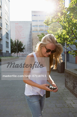 Young woman using cellular phone