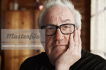 Senior man with grey hair and glasses