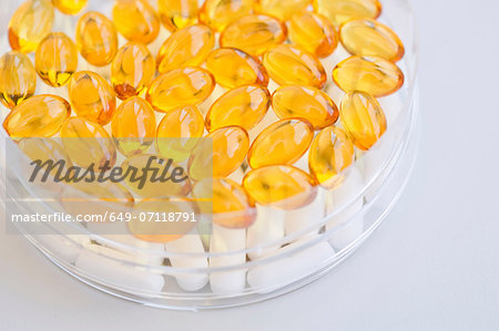 Close up of fish oil capsules in petri dish