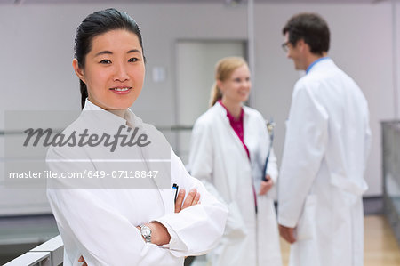 Small group of scientists in laboratory atrium