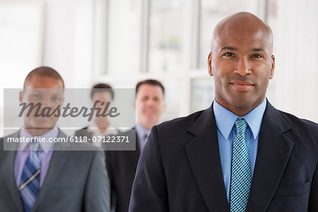 Business People. A Team Of People, A Department Or Company. Three Men And One Woman.