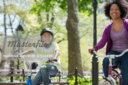 A Family In The Park On A Sunny Day. A Mother And Son.