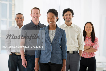 Business. A Team Of People, A Multi Ethnic Group, Men And Women In A Group.