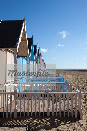 Colourful beach huts at West Mersea, Essex, England