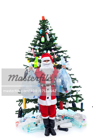 Wasted christmas - environment concept with santa and plastic bottles decorated tree