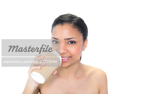 Cute young dark haired model drinking coffee on white background