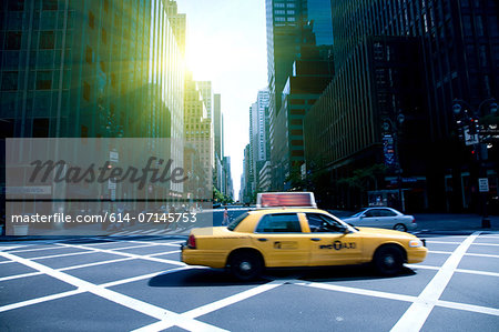 Yellow cab on grid, New York, New York State, USA