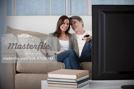 Mature couple watching tv