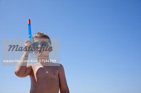 Young boy with snorkel and goggles