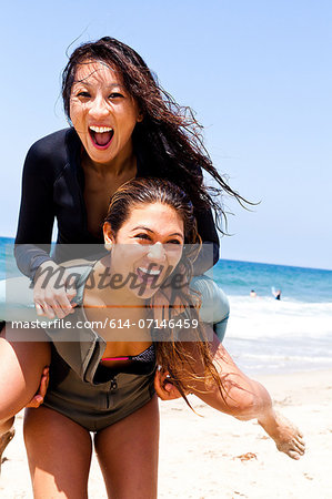 Female friends fooling around, Hermosa Beach, California, USA