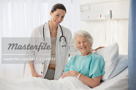 Portrait of doctor and aging patient in hospital room