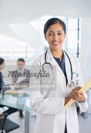 Portrait of smiling doctor in meeting