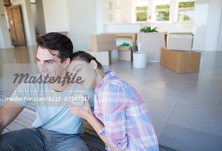 Couple drinking coffee in new house