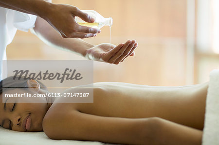 Woman receiving massage at spa