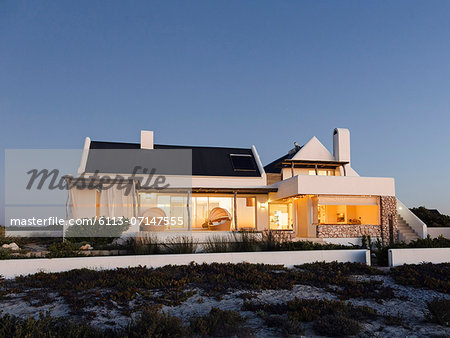 Modern house illuminated at night