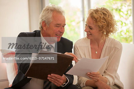Financial advisor explaining paperwork to woman