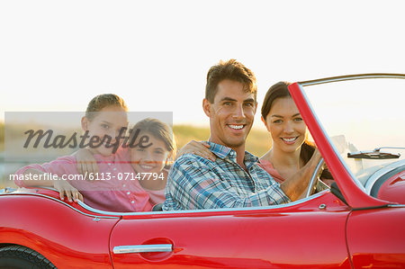 Family in convertible together