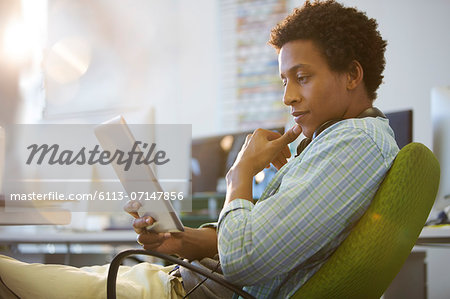 Businessman using digital tablet in office