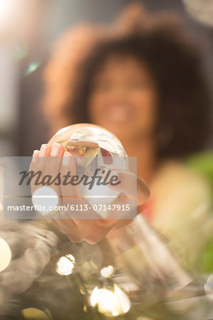 Close up of woman holding crystal ball