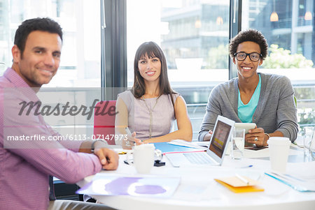 Portrait of business people smiling in meeting