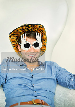 Smiling man wearing silly glasses Smiling man wearing silly glasses