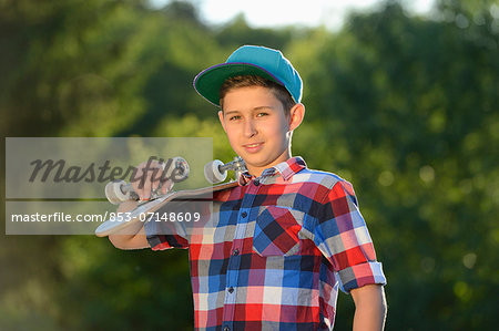 Boy with skateboard, portrait