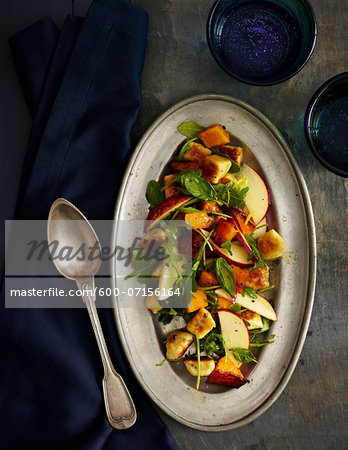 Roasted Pumpkin with Gnudi and Apples on platter, studio shot