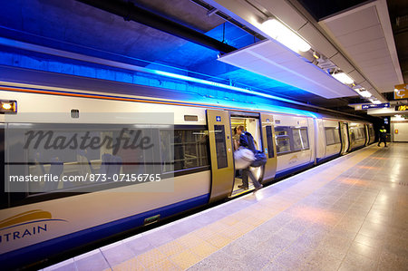 Passanger getting onto the Gautrain at the Gautrain Sandton Station