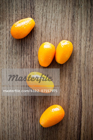 Kumquat fruits on wooden table