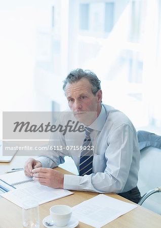 Businessman sitting at desk in office