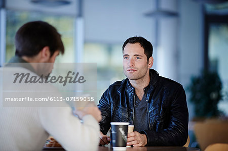 Men having coffee in cafe
