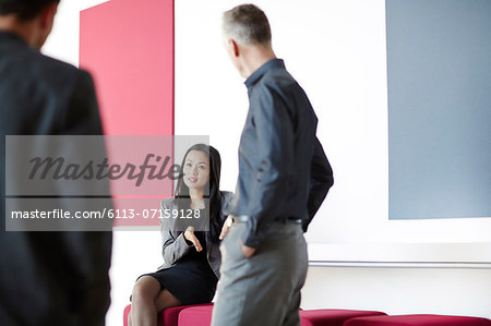 Business people talking in lobby