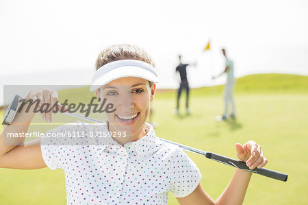 Woman holding golf club