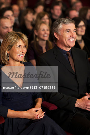 Smiling couple in theater audience