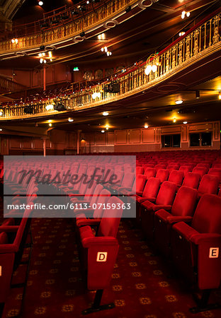 Seats in empty theater auditorium