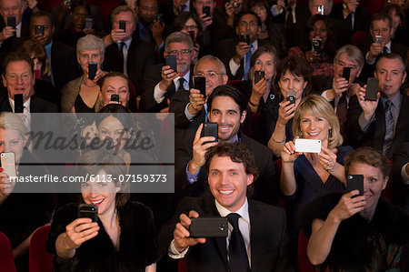 Theater audience videoing performance with smart phones