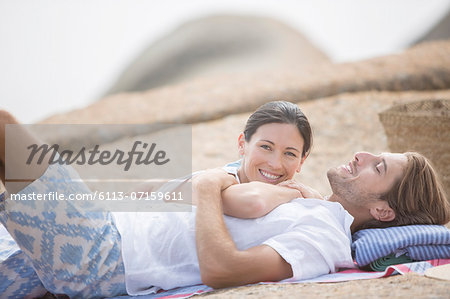 Couple relaxing on beach together