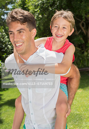 Father and son playing in backyard