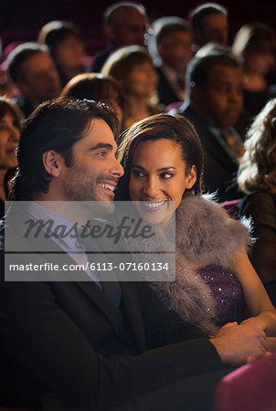 Smiling couple in theater audience