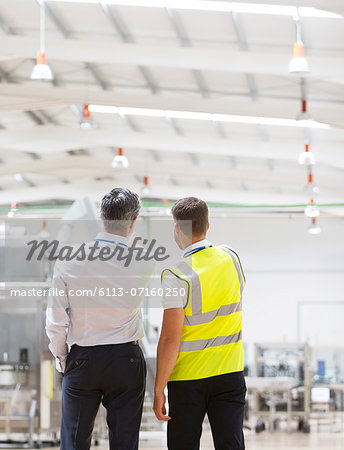 Supervisor and worker talking in warehouse