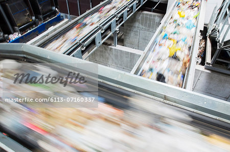 Blurred view of conveyor belts in recycling center