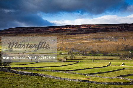 Clouds over rural hills