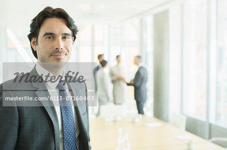 Businessman smiling in conference room