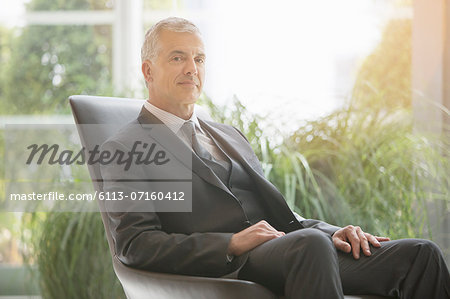 Businessman sitting in leather chair