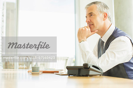 Businessman sitting at desk in office