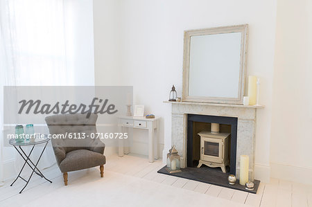 Armchair and fireplace in living room