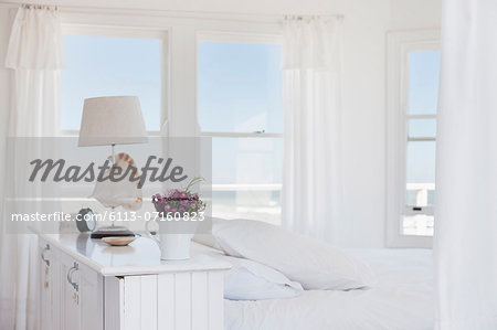 Shell lamp in bedroom overlooking ocean