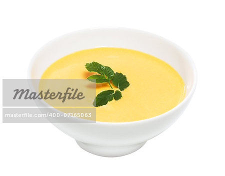 Cream of pumpkin soup, isolated on white background